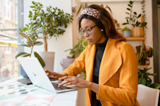 student sat at laptop